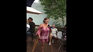 Mature LAK Amputee Lady Singing and Swinging Stump